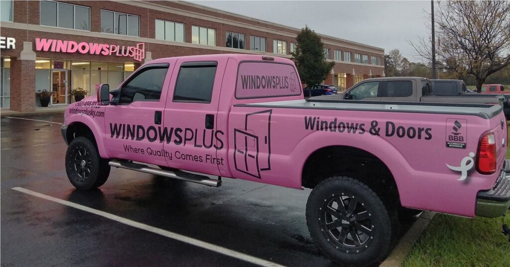 Windows Plus pickup truck with branded pink wrap